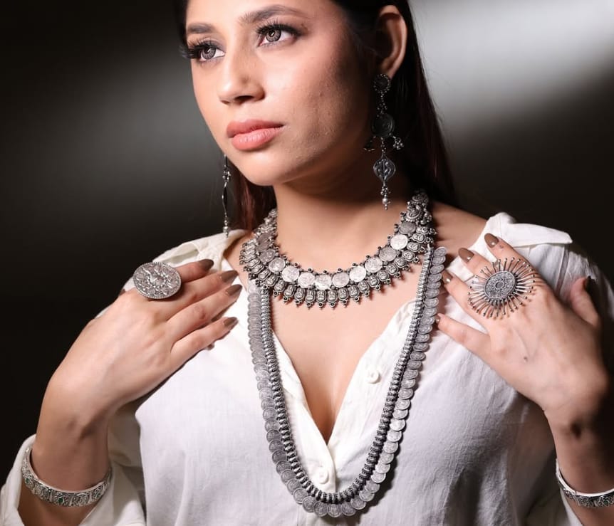 women wearing silver jewellery set